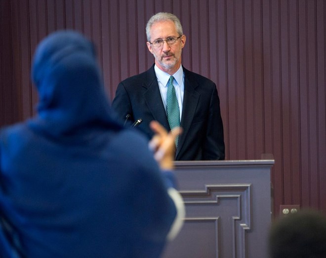 Stephen Schwartz, the U.S. ambassador to Somalia, listens to a woman's question while speaking with the public in Lewiston on Thursday. Schwartz fielded questions about the Somalian government, American foreign policy in Africa, and President Trump’s executive order that would impose a 90-day ban on travelers from six Muslim-majority countries, including Somalia. Staff photo by Derek Davis
